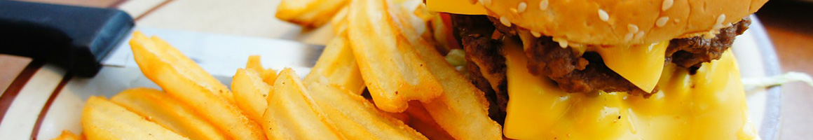 Eating Burger at Lucky's Drive-In restaurant in Parkland, WA.